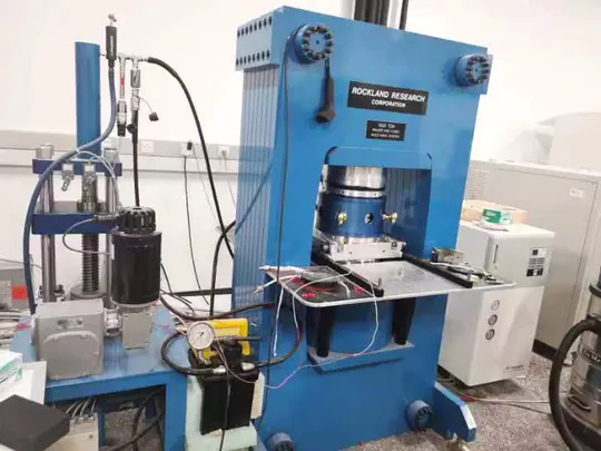 Two-stage high pressure and high temperature press